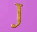 Symbol Letter J slot Thrones of Persia by Tom Horn Gaming