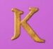 Symbol letter K slot Thrones of Persia by Tom Horn Gaming
